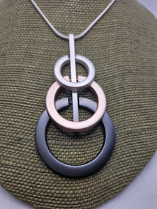 1986 Long Sweater Tri-Color Circle Necklace.  Silver, Rosegold, and Gun Metal.